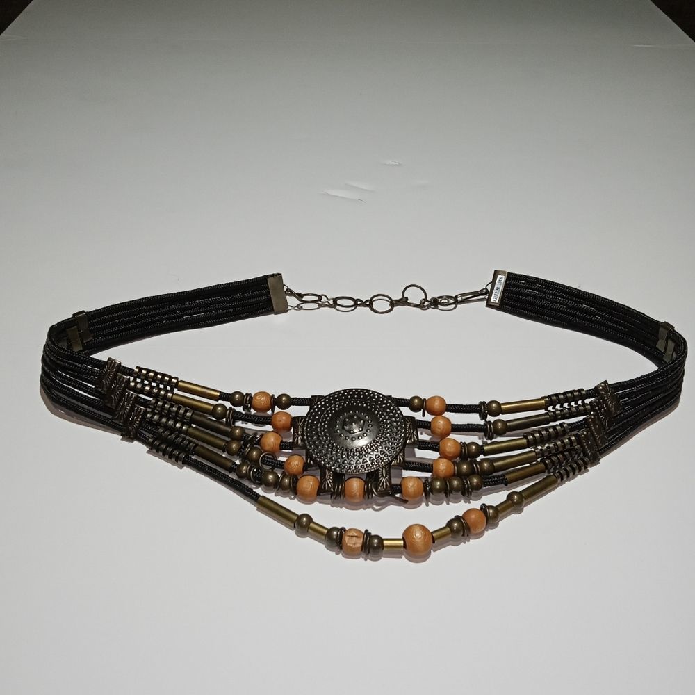 Vintage bohemian decorative belt with metal and wooden beads. Boho accessories.